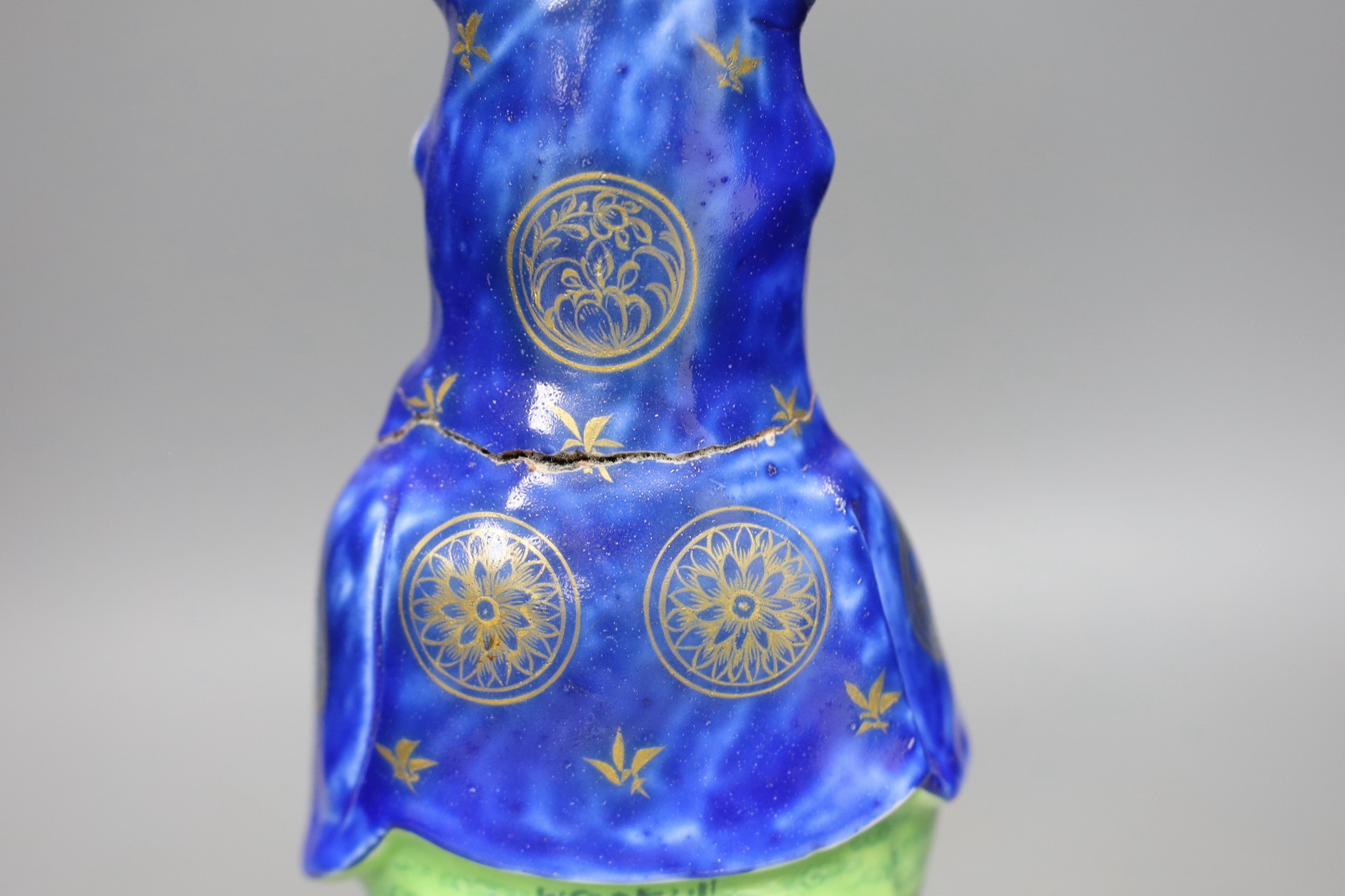 A Chinese enamelled porcelain figure of Guanyin, Jiaqing - Daoguang period, damage, 34cms high